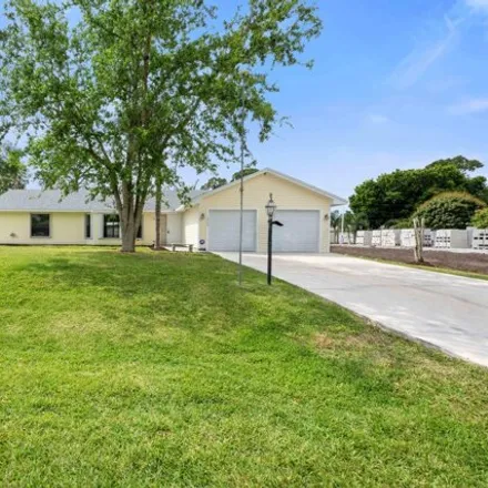 Buy this 3 bed house on 1792 Southwest Bellevue Avenue in Port Saint Lucie, FL 34953