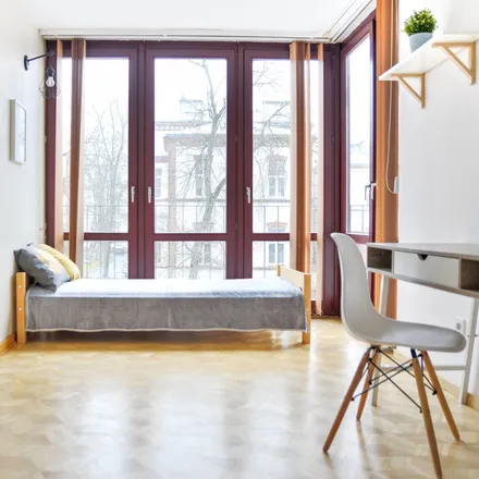 Rent this 4 bed room on Nowogrodzka 62B in 02-002 Warsaw, Poland