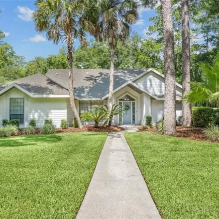 Buy this 4 bed house on 8956 SW 44th Ln in Gainesville, Florida