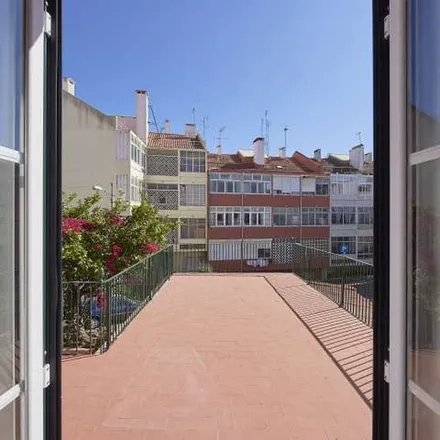 Rent this 14 bed apartment on Travessa do Galvão in 1400-077 Lisbon, Portugal