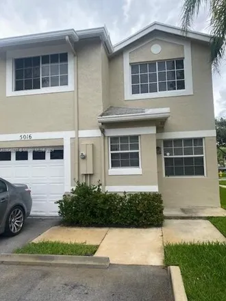 Rent this 3 bed townhouse on 5016 SW 123rd Ter Unit 5016 in Cooper City, Florida