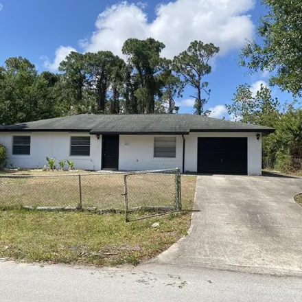 Rent this 3 bed house on 417 Saul Road Southwest in Palm Bay, FL 32908