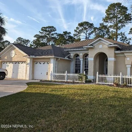 Buy this 4 bed house on 41 Woodhollow Lane in Palm Coast, FL 32164
