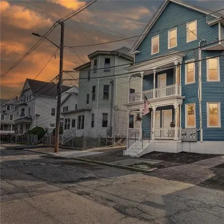 Buy this 9 bed townhouse on 86 Ellery Street in Olneyville, Providence