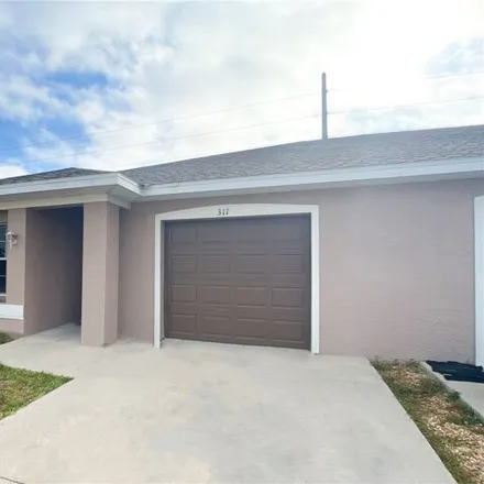 Image 1 - 323 Northeast 24th Avenue, Cape Coral, FL 33909, USA - House for rent