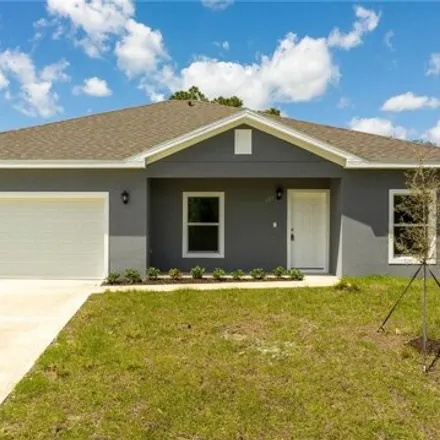 Buy this 4 bed house on 998 Quaker Street Southeast in Palm Bay, FL 32909