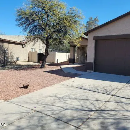 Rent this 3 bed apartment on 5599 South Forgeus Avenue in Tucson, AZ 85706