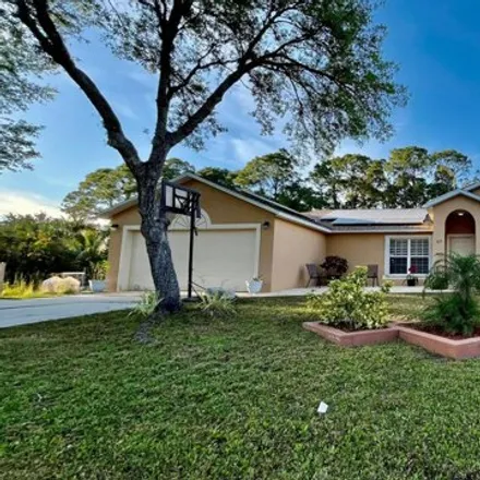 Rent this 3 bed house on 419 Harrison Street Southwest in Palm Bay, FL 32908