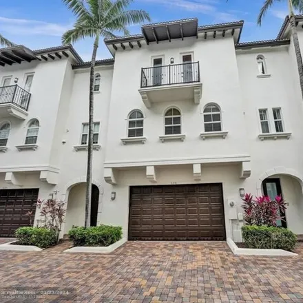 Rent this 4 bed townhouse on 3257 Northeast 13th Street in Country Club Isles, Pompano Beach