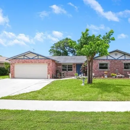 Rent this 3 bed house on 1210 SW 26th Ave in Boynton Beach, Florida