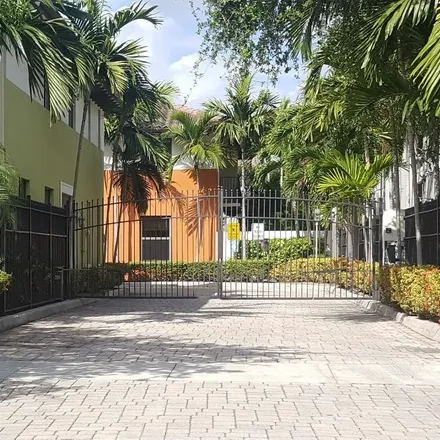 Rent this 3 bed townhouse on 3028 McDonald Street in South Bay Estates, Miami
