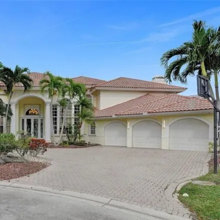 Buy this 5 bed house on Eagle Trace Golf Club in 1111 Eagle Trace Boulevard West, Coral Springs