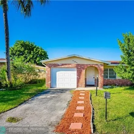 Rent this 4 bed house on 973 Northwest 48th Place in Crystal Lake, Deerfield Beach