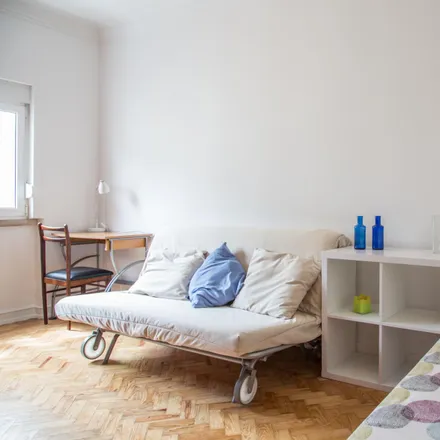 Rent this 4 bed room on Rua Doutor Álvaro de Castro in 1600-069 Lisbon, Portugal