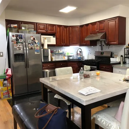 Buy this 8 bed townhouse on 43-19 165th Street in New York, NY 11358