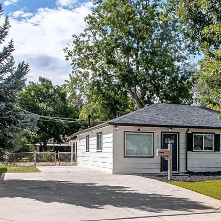 Buy this 4 bed house on 1217 Victor Street in Aurora, CO 80011