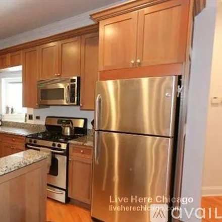 Rent this 3 bed apartment on 1447 W Berteau Ave
