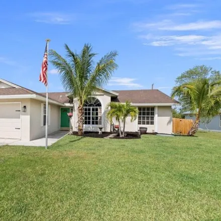 Buy this 3 bed house on 2353 Southwest Vale Street in Port Saint Lucie, FL 34953