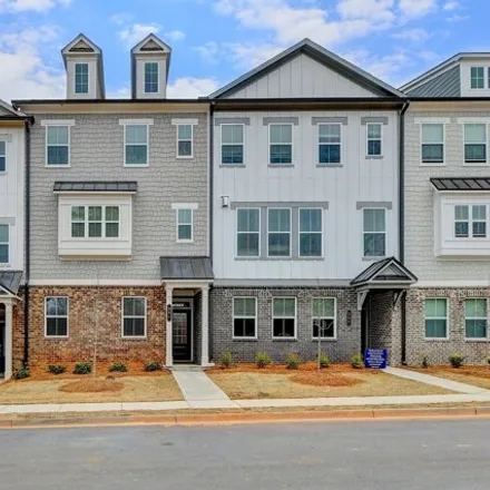 Rent this 4 bed townhouse on Peachtree Industrial Boulevard in Suwanee, GA 30518