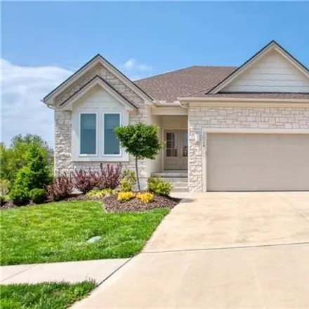Buy this 4 bed house on Northeast Legacy Wood Drive in Lee's Summit, MO 64086