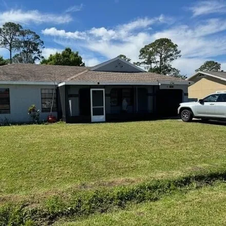 Rent this 3 bed house on 1462 Talbott Street Southeast in Palm Bay, FL 32909
