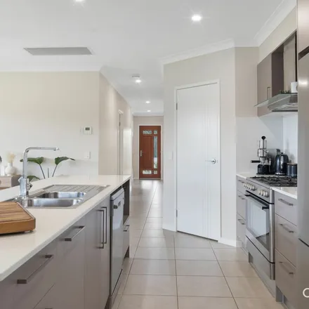 Rent this 4 bed apartment on Miamax Place in Logan Reserve QLD 4133, Australia