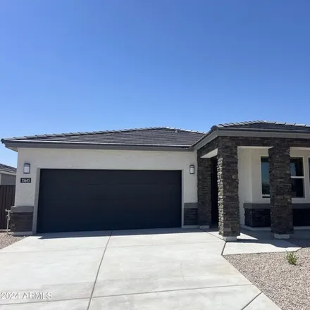 Rent this 4 bed house on 15645 West Desert Hollow Drive in Surprise, AZ 85387