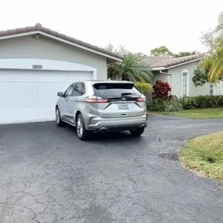 Rent this 3 bed house on 2056 Northwest 86th Way in Coral Springs, FL 33071