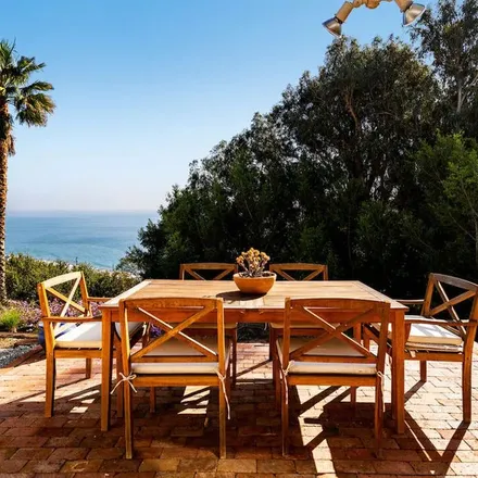 Rent this 2 bed apartment on 225389 Carbon Mesa Road in Malibu, CA 90265