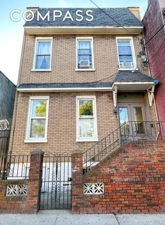Buy this 7 bed townhouse on 1726 Gates Avenue in New York, NY 11385