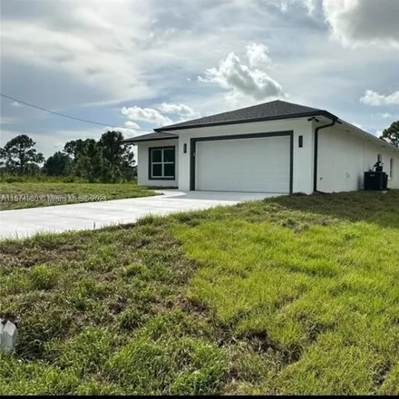 Rent this 4 bed house on 1171 Milwaukee Boulevard in Lehigh Acres, FL 33974