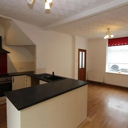 Rent this 2 bed townhouse on Commercial Street in Senghenydd, CF83 4HR