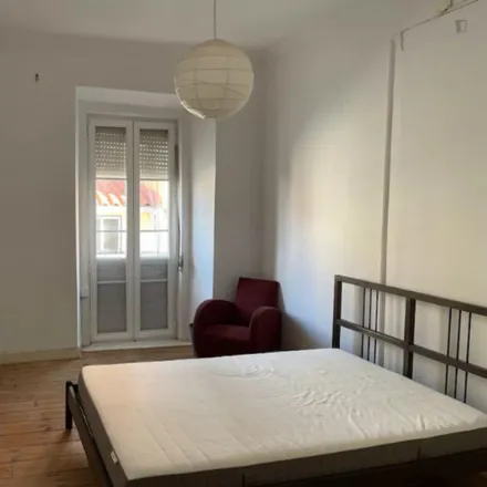 Rent this 4 bed room on Rua da Fé 51 in 1150-251 Lisbon, Portugal