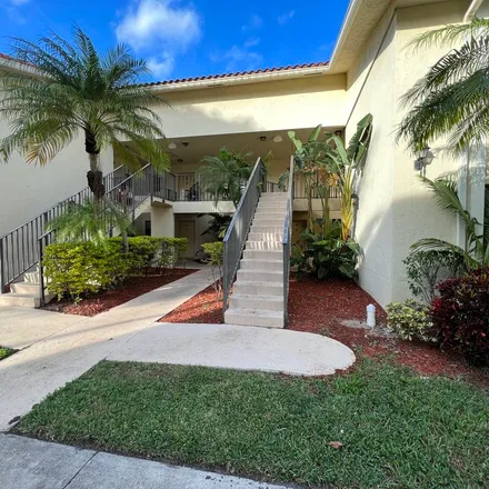 Rent this 3 bed apartment on 1650 Windorah Way in Golden Lakes, Palm Beach County