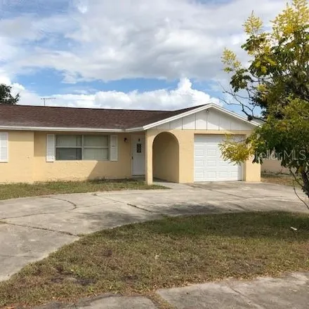 Rent this 3 bed house on 8746 Roble Way in Jasmine Estates, FL 34668