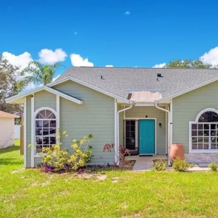 Buy this 4 bed house on 3575 Nikon Court in Titusville, FL 32796