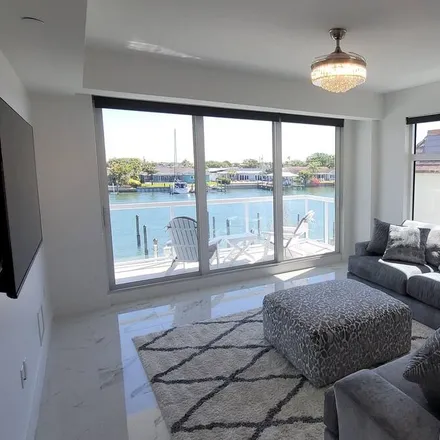 Rent this 4 bed condo on Clearwater in FL, 33767