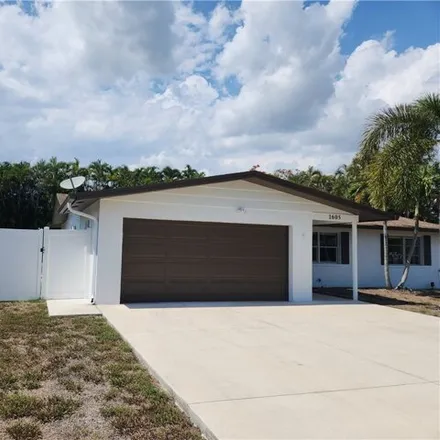 Rent this 3 bed house on 1611 South Mayfair Road in Cypress Lake, FL 33919