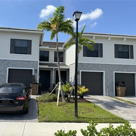 Rent this 3 bed townhouse on 145 Southeast 5th Court in Carver Heights, Deerfield Beach