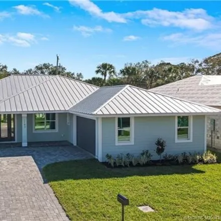 Buy this 4 bed house on 1165 Northeast Orange Avenue in Martin County, FL 34957