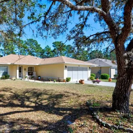 Buy this 3 bed house on 7749 North Cricket Drive in Citrus Springs, FL 34434
