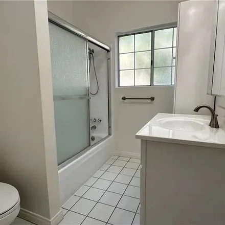 Rent this 3 bed apartment on 1245 South Longwood Avenue in Los Angeles, CA 90019