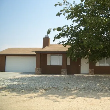 Rent this 3 bed house on 9120 Peach Ave