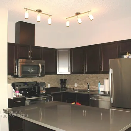 Rent this 2 bed townhouse on 9825 in Savaryn Drive SW, Edmonton