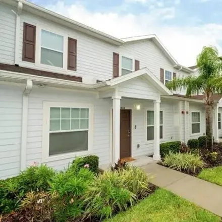 Rent this 3 bed townhouse on 3220 Cupid Pl in Kissimmee, Florida