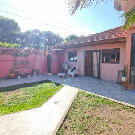 Buy this 3 bed house on Cuyo in Partido de Lomas de Zamora, B1846 AAQ Llavallol