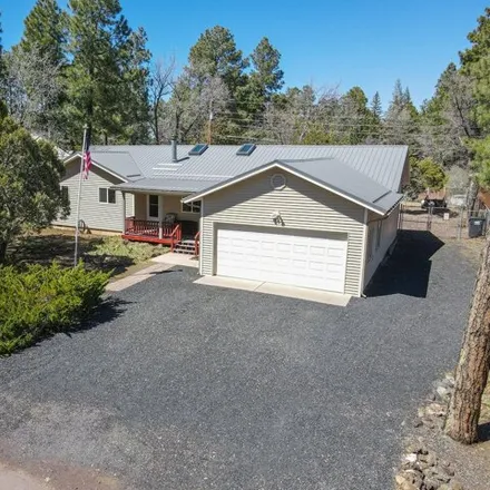 Buy this 4 bed house on 5076 Blue Spruce Lane in Lake of the Woods, Navajo County