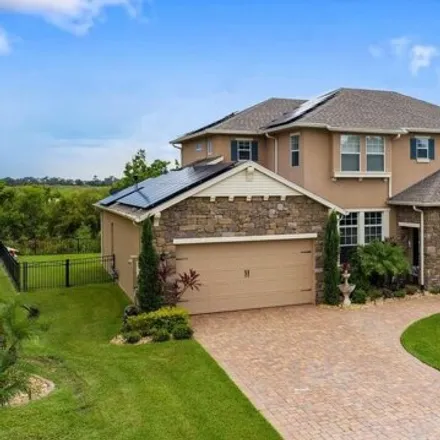 Buy this 5 bed house on 15246 Johns Lake Pointe Blvd in Winter Garden, Florida