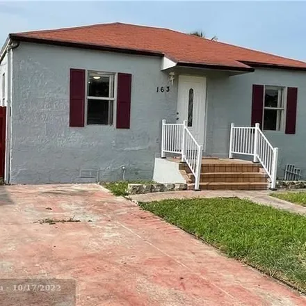 Rent this 4 bed house on 157 Southwest 5th Street in Carver Heights, Deerfield Beach