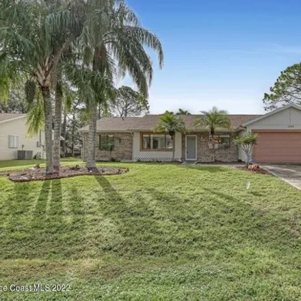 Rent this 3 bed house on 1348 Kayford Street Northwest in Palm Bay, FL 32907